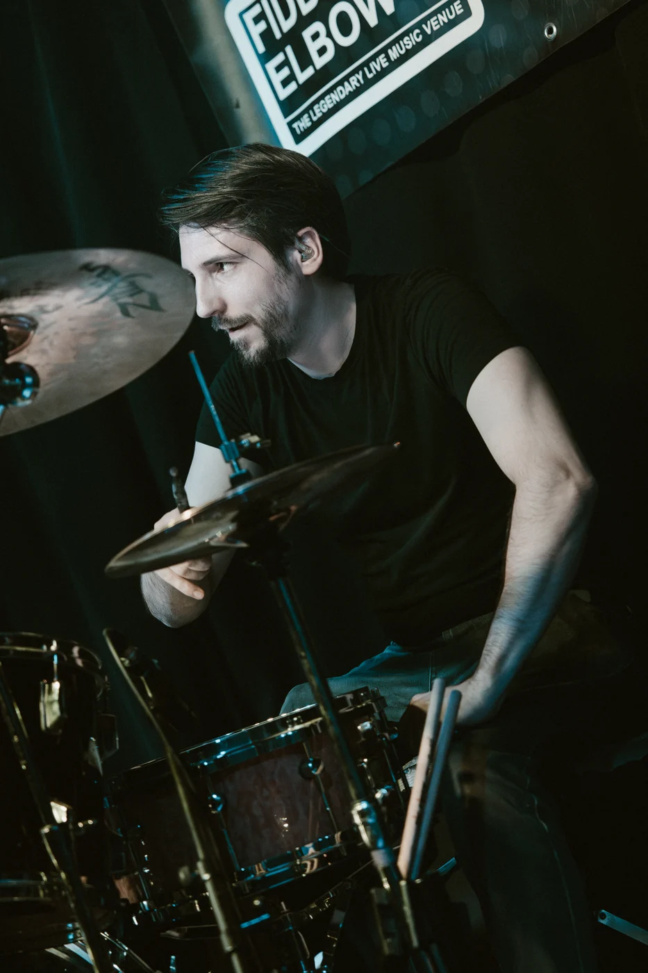 Alex performing at the Fiddler's Elbow