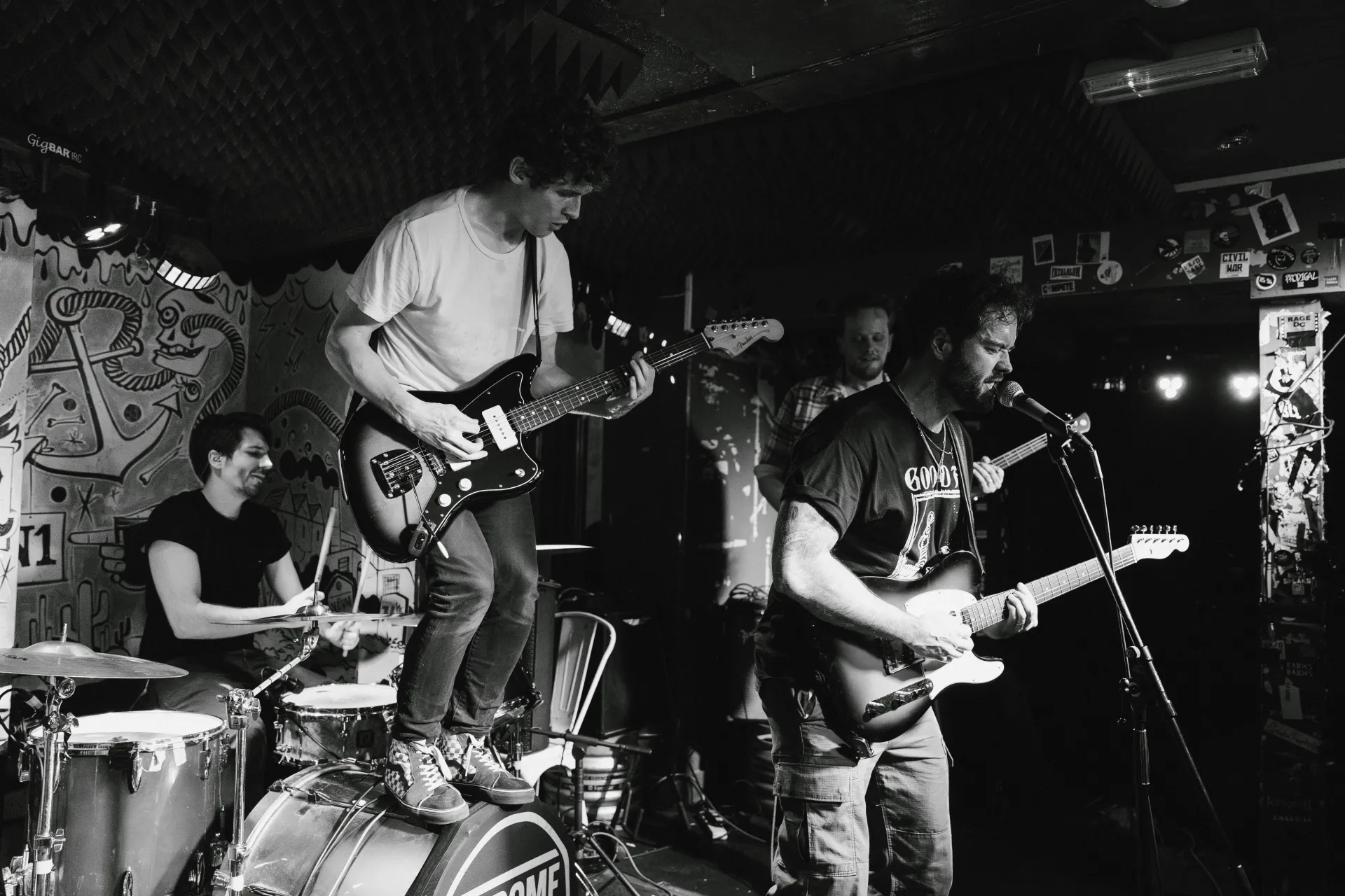Pete, David, Sam and Alex playing together on stage