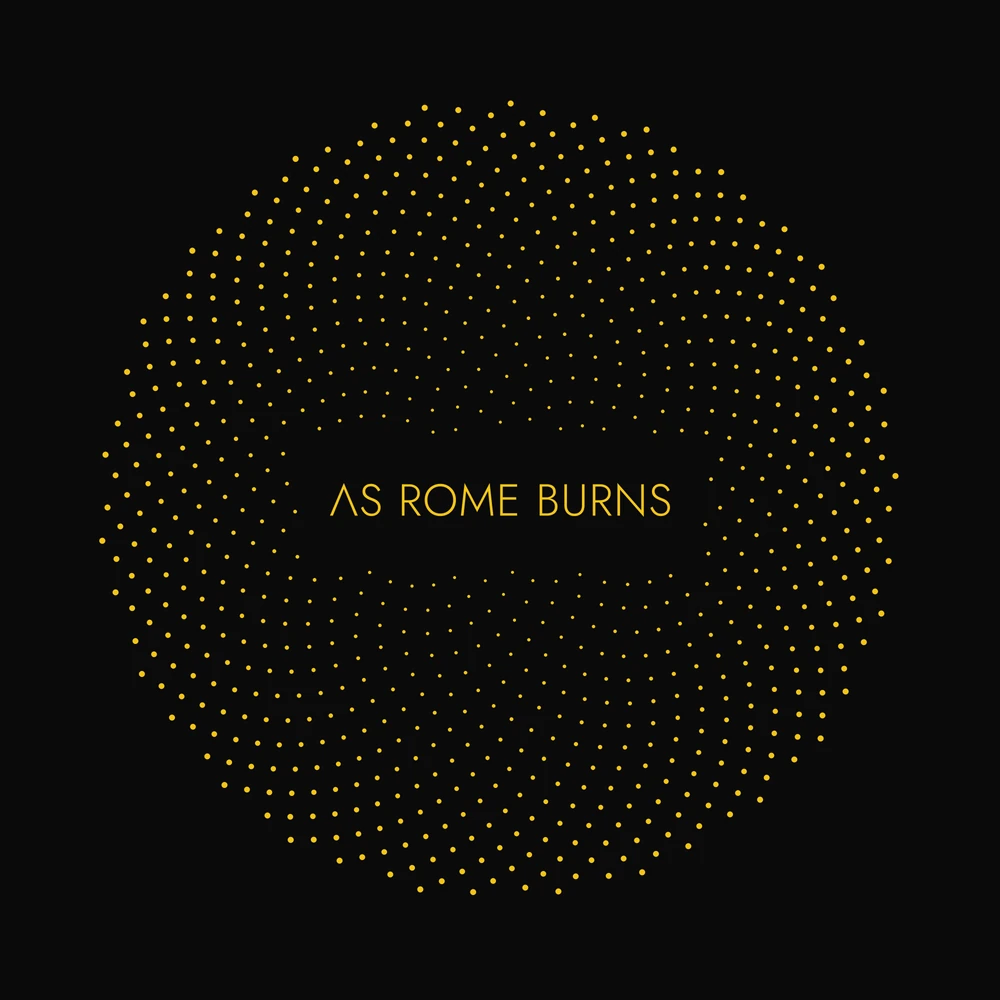 The original Orbit shirt artwork, gold geometry and the As Rome Burns wordmark on black